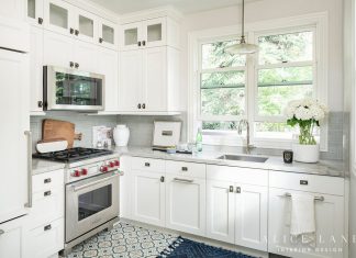 White kitchen with sink, oven and microwave