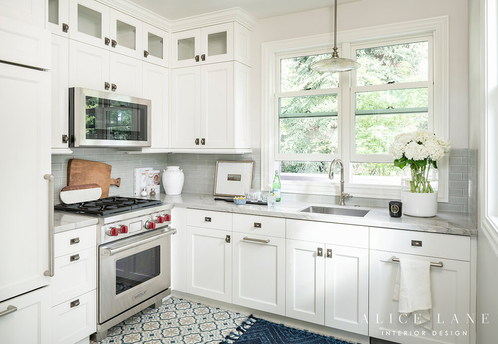 Kitchen with white cabinet, oven, sink and fridge