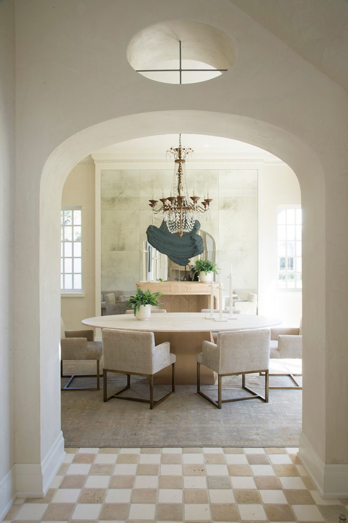 Dining room with chairs, table and chandelier