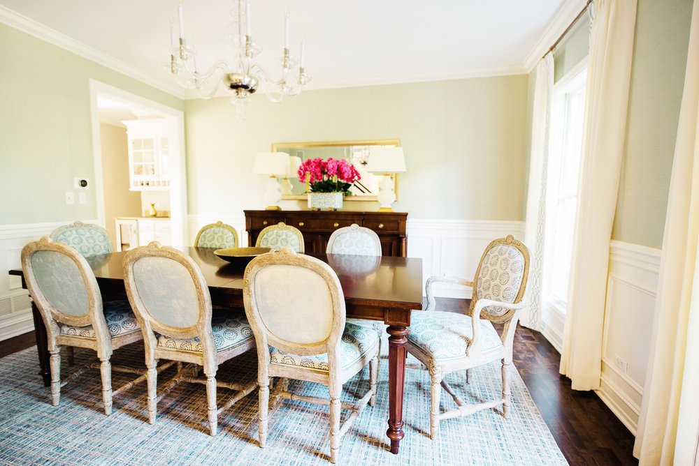 Dining room with table and chairs around it