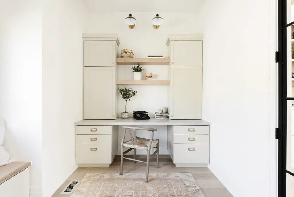 Home office with table, cabinet and chair designed in simple Mediterranean style