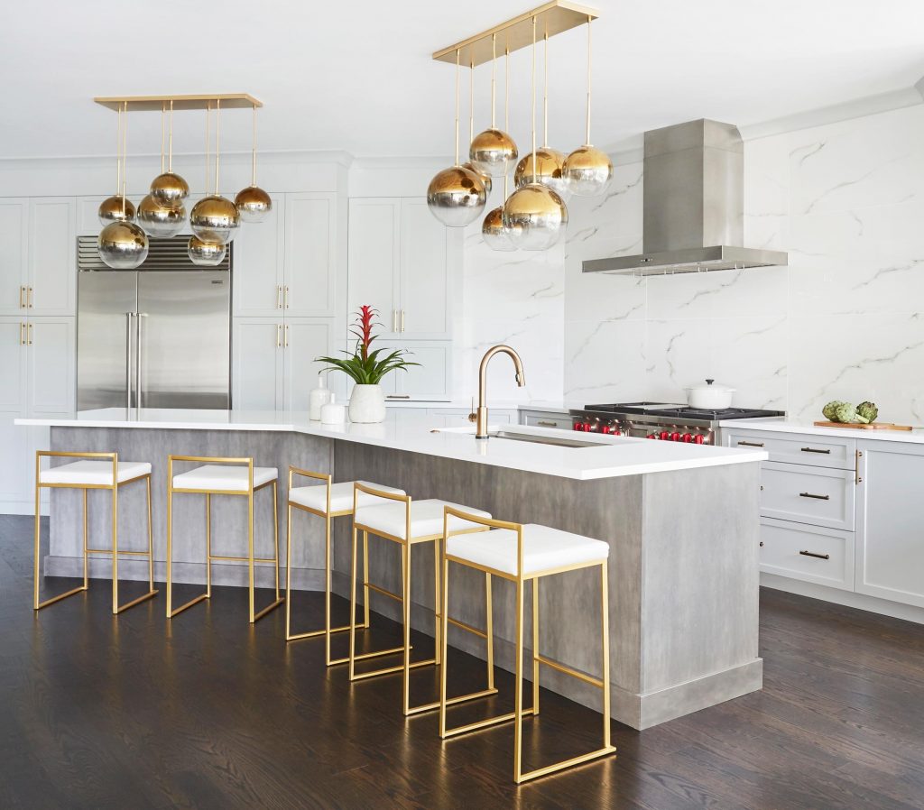 Kitchen with bar and bar chairs