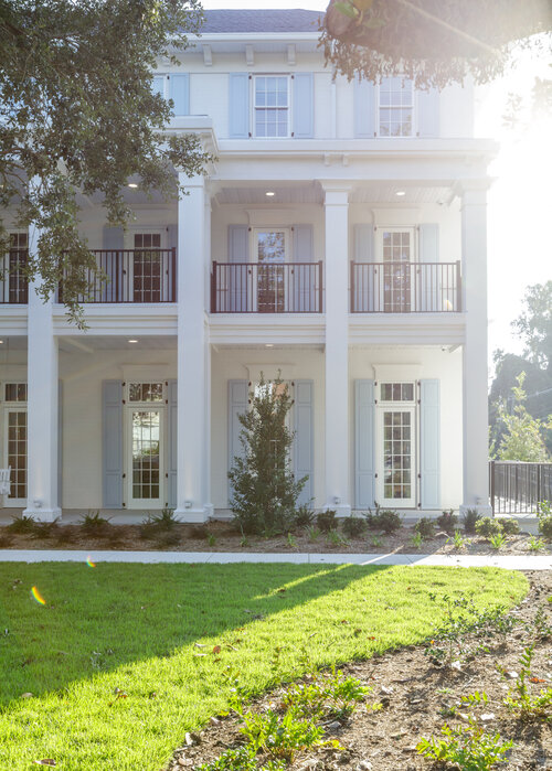 White house and a lawn in front of it