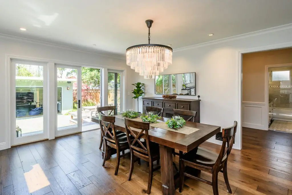 Dining room with dark wood table and crystal celling