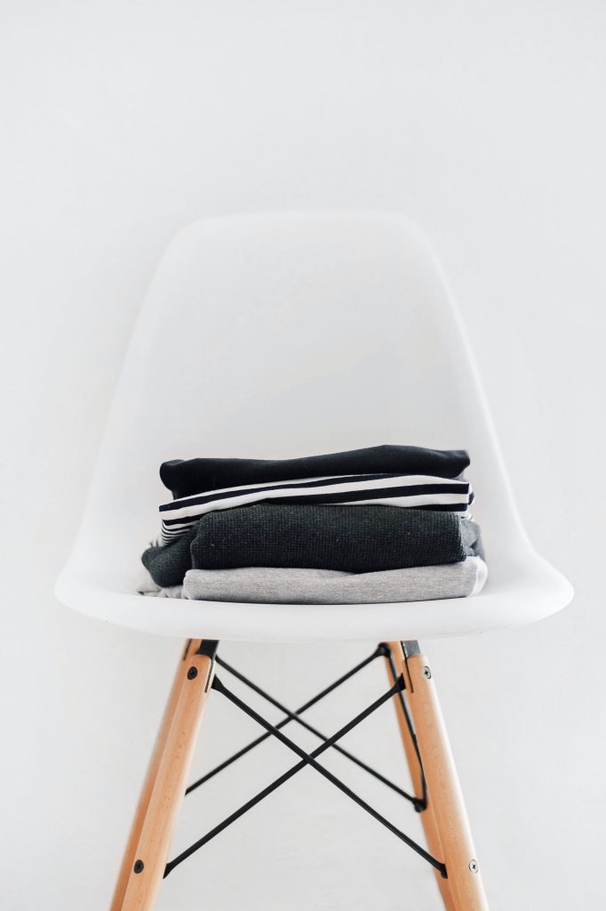 Stacked clothes on the white chair