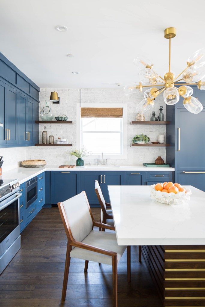 Kitchen with dining table and blue kitchen cabinet