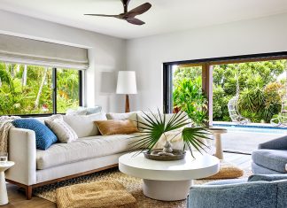 Living room with tropical view from windows