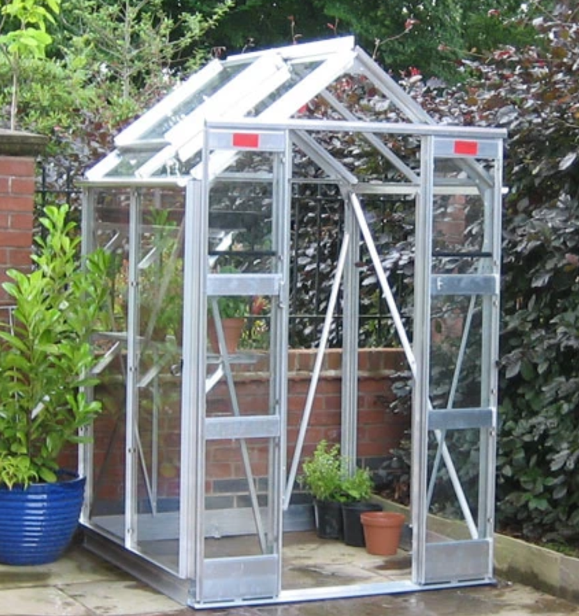 A small greenhouse in the backyard