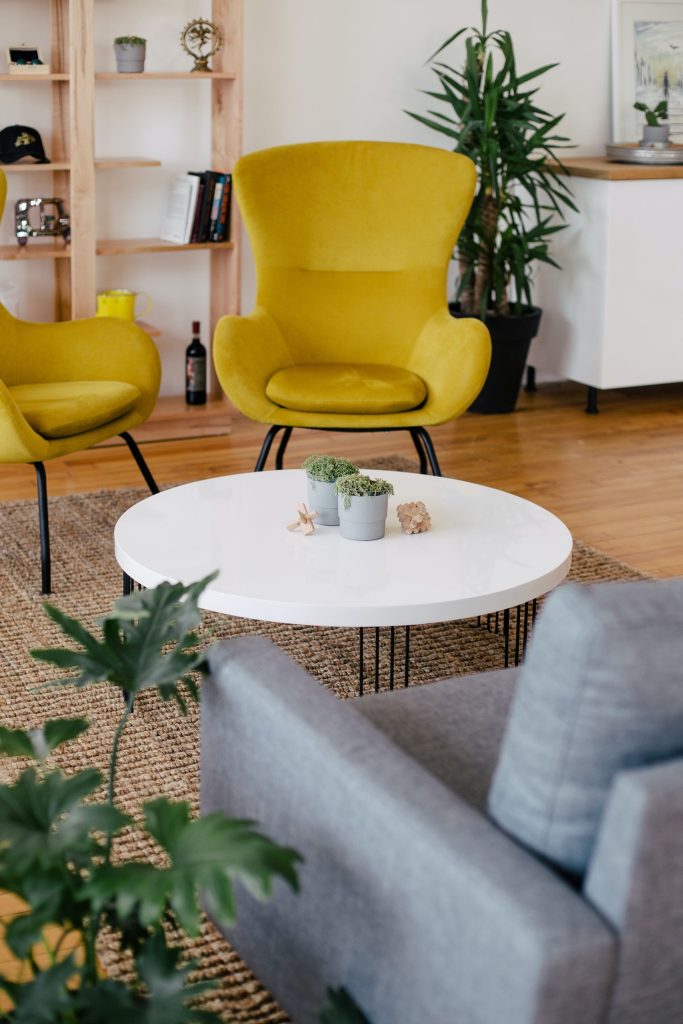 Coffee table and yellow armchairs in the living room