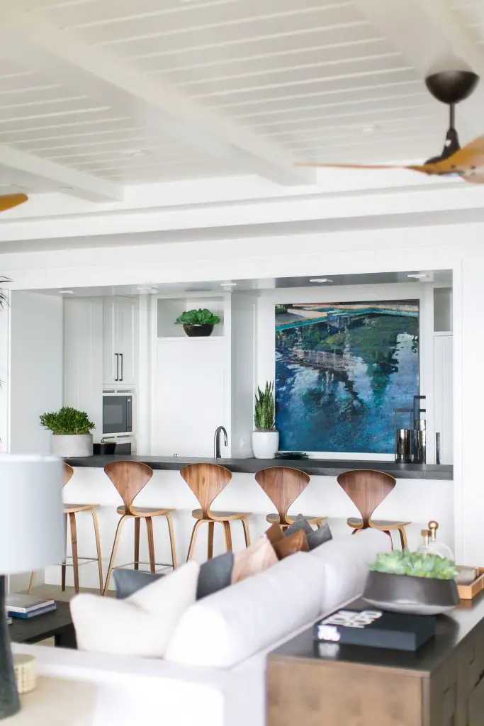 Kitchen with kitchen island and bar chairs