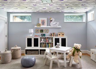 Kid's room with book shelfs, table, chairs and toys