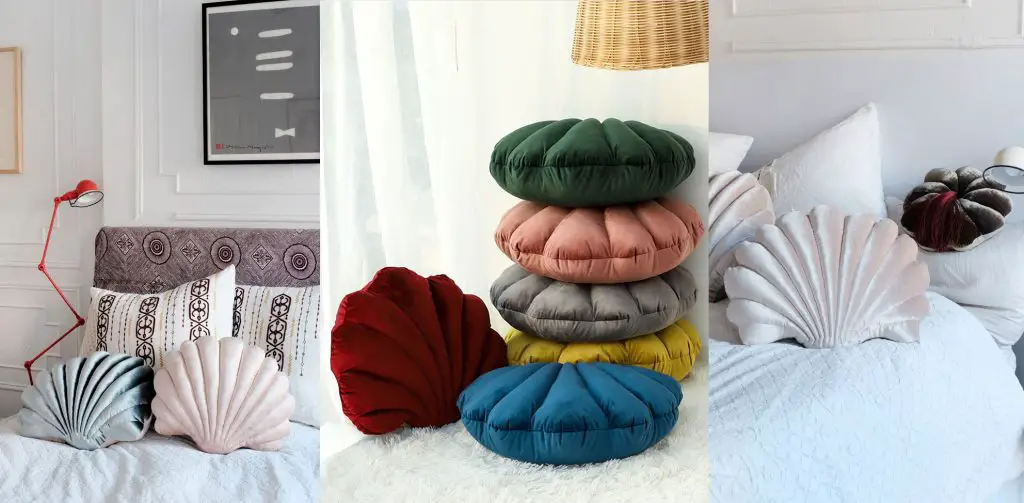 Shell-shaped pillows on a bed