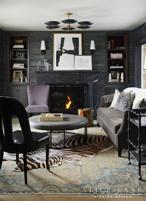 Dark living room with firework, coffee table, chair and sofa