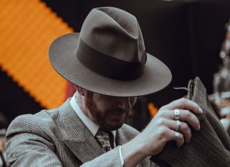 Men in a suit wearing fedora hat
