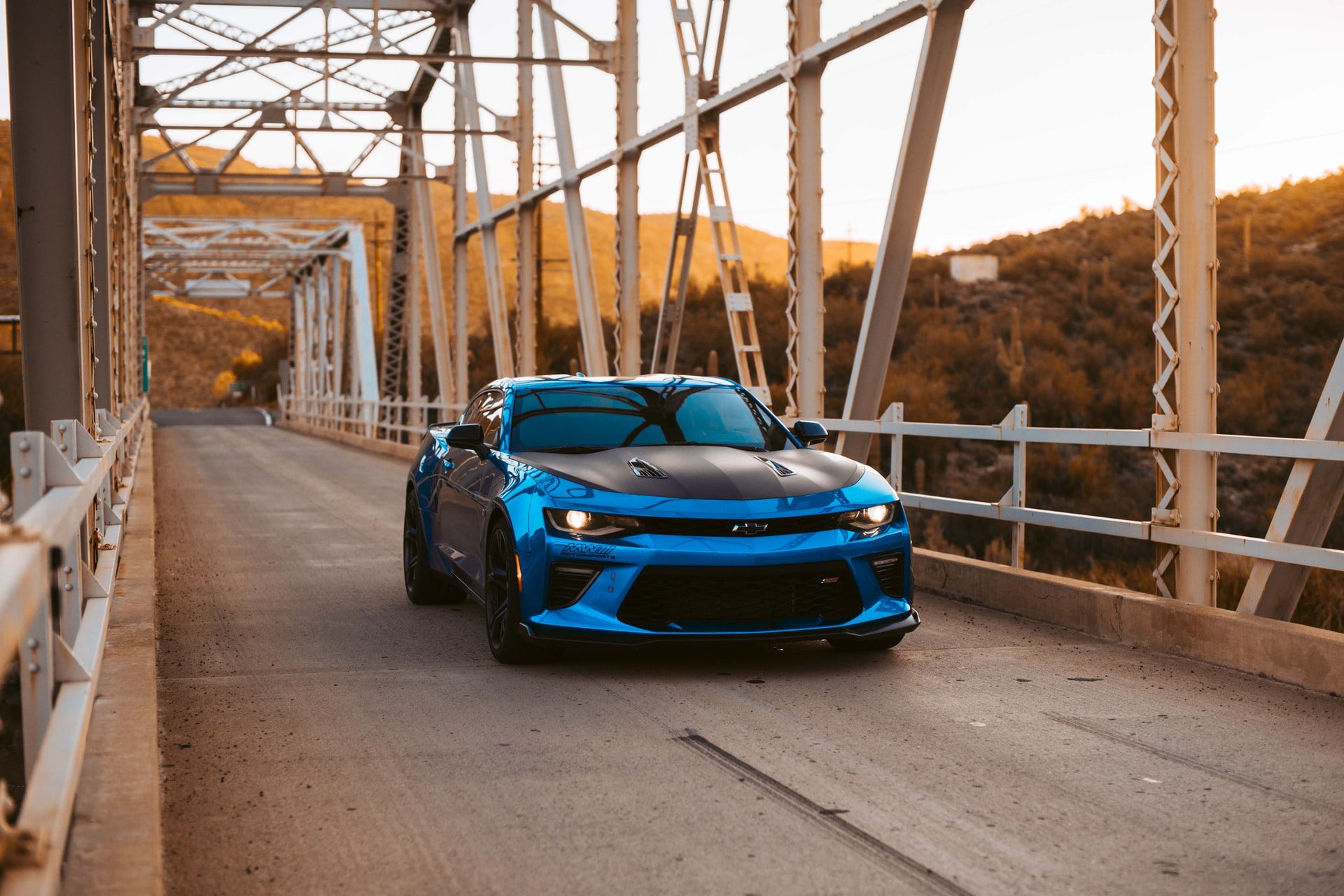 Blue Chevrolet Camaro on the bridge