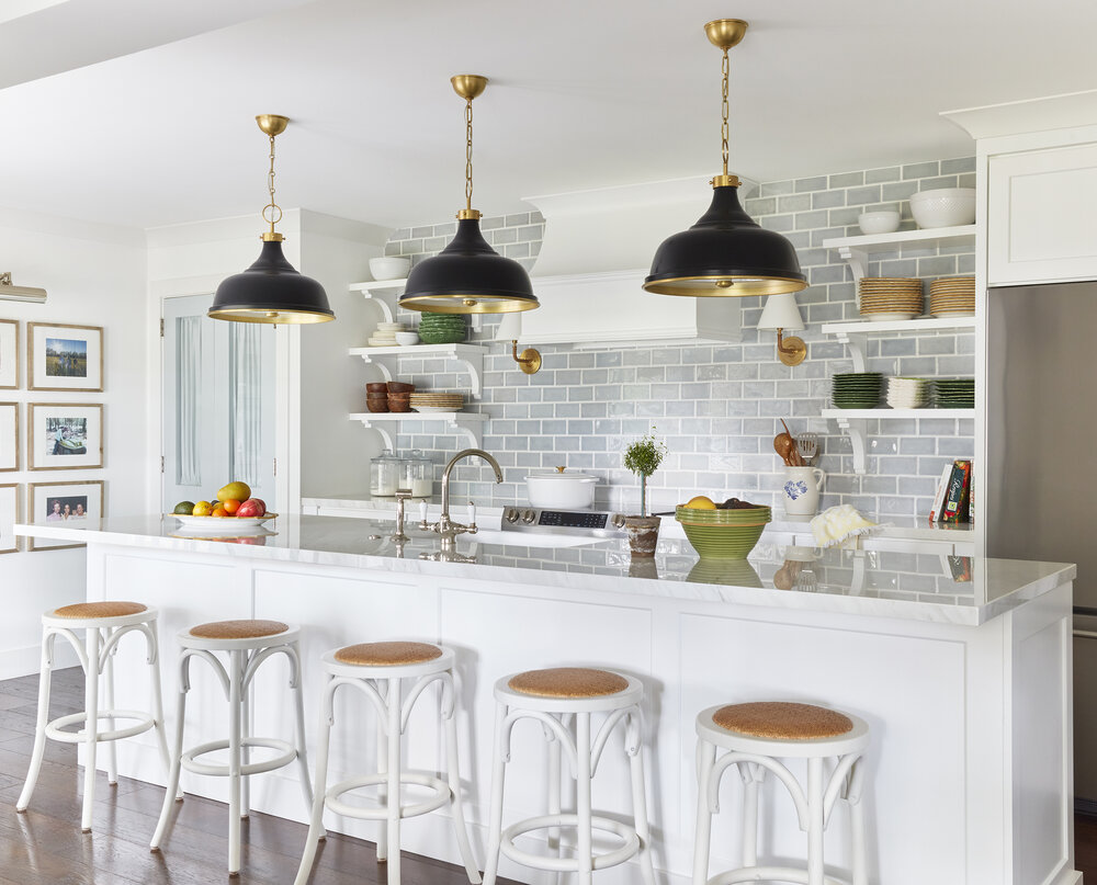 Kitchen with island table and bar chairs