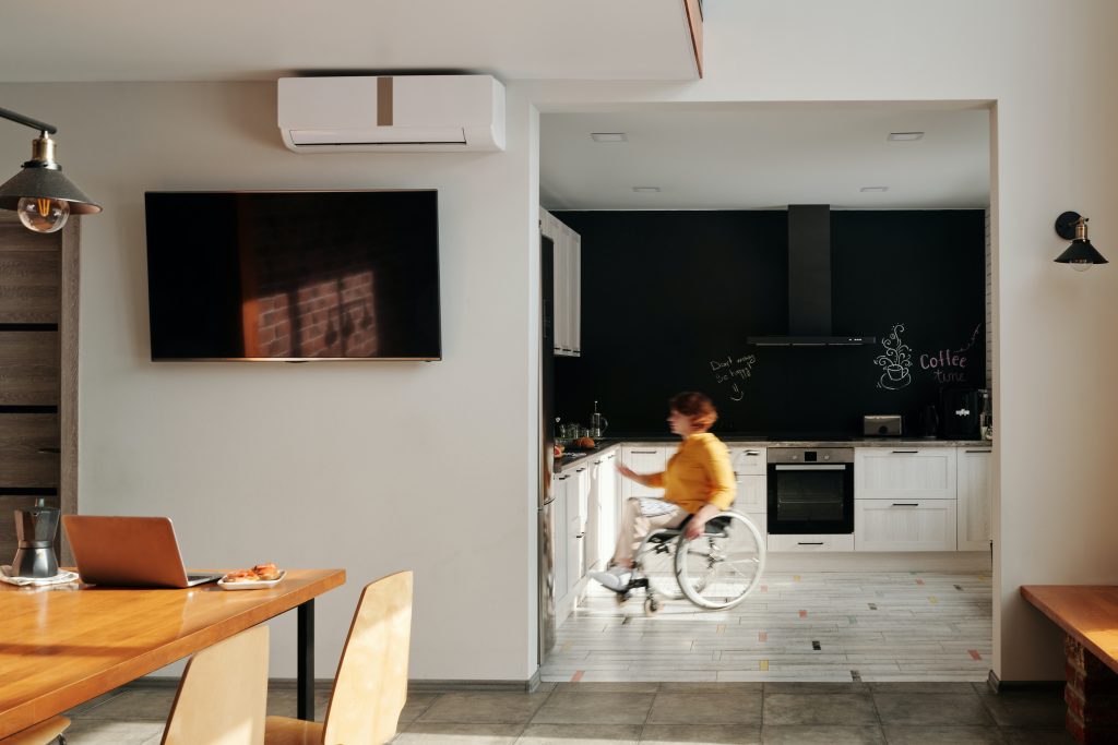 Kitchen and a woman in a wheelchair
