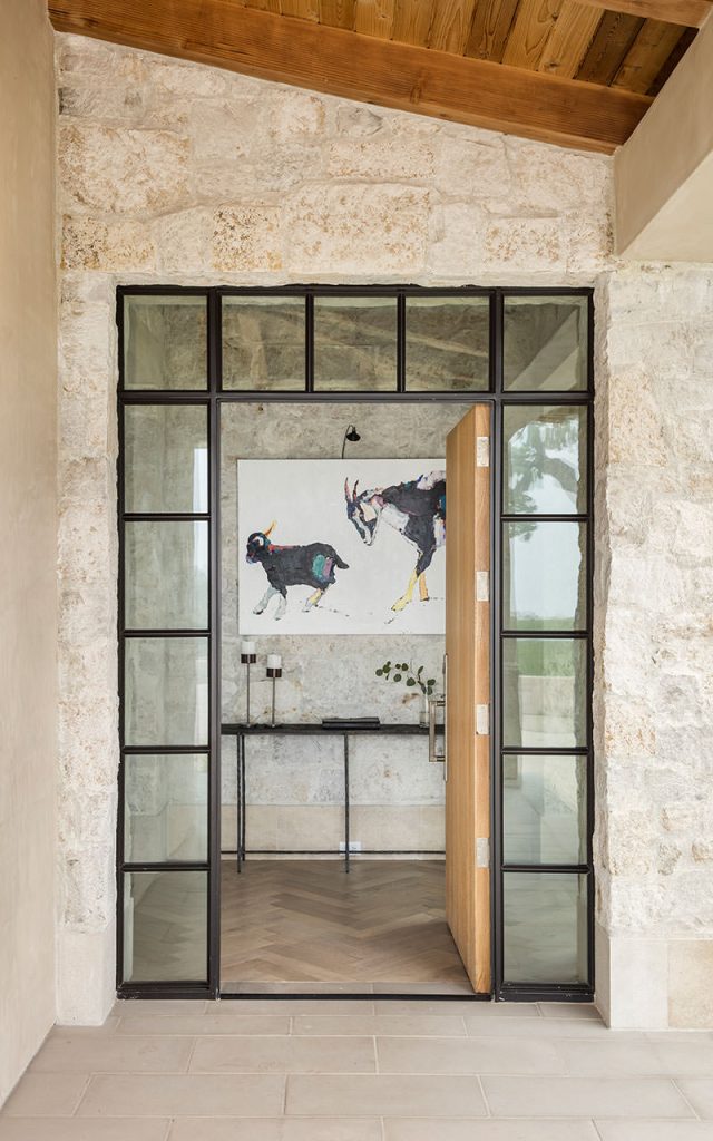 Doors and a image of goats in the hall
