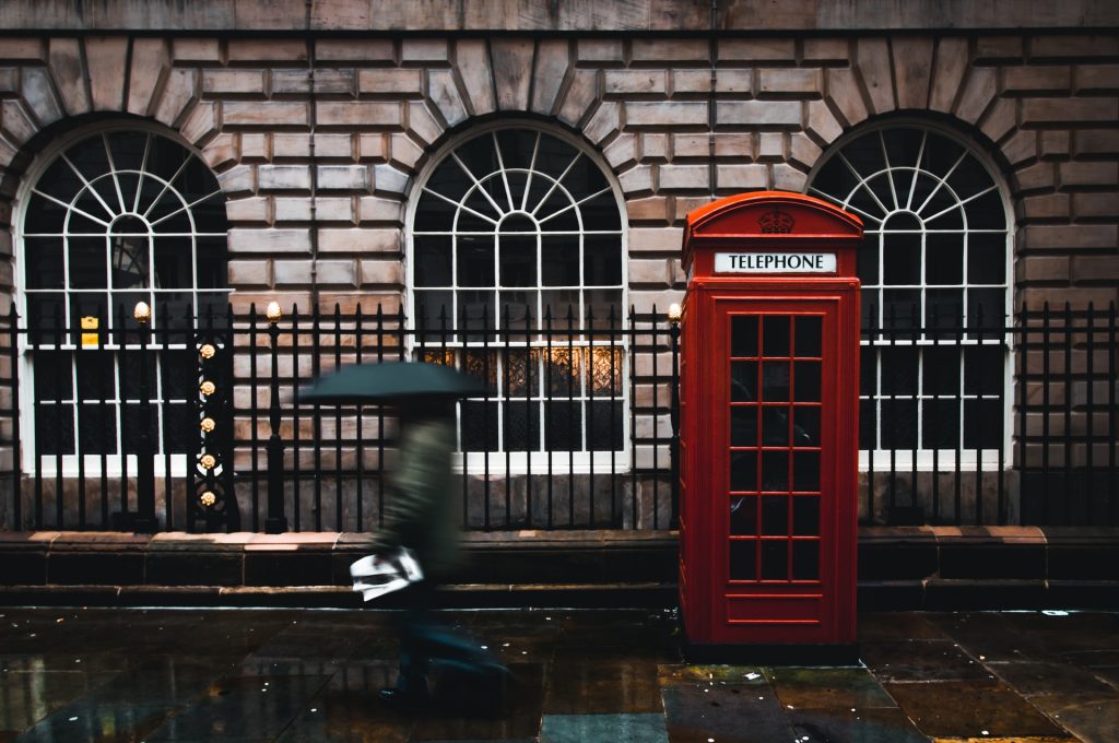 Red phone booth on the street in UK