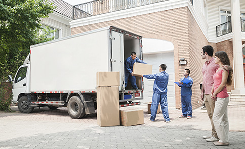 Movers with the truck and boxes