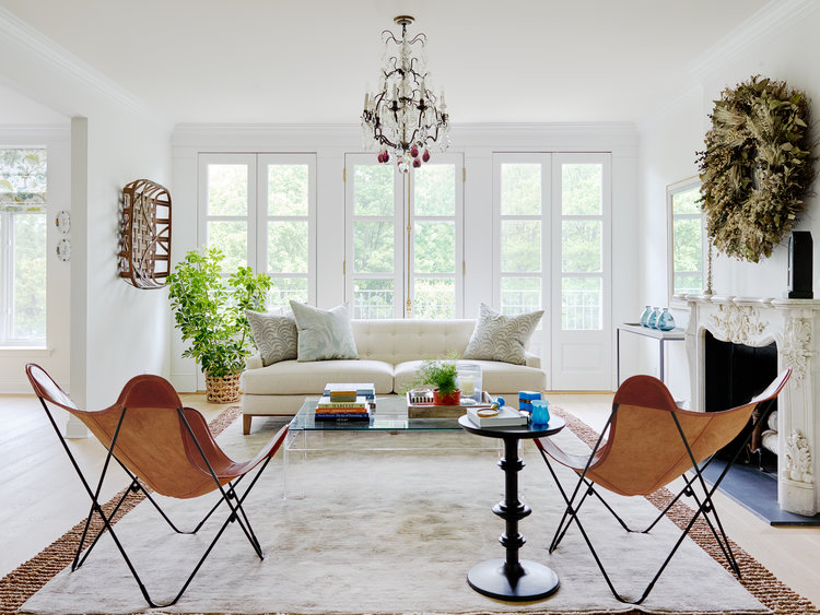 Living room with couch, coffee table and chairs