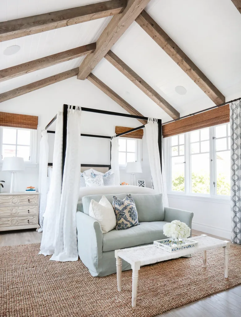 Framed double bed with sofa in bedroom