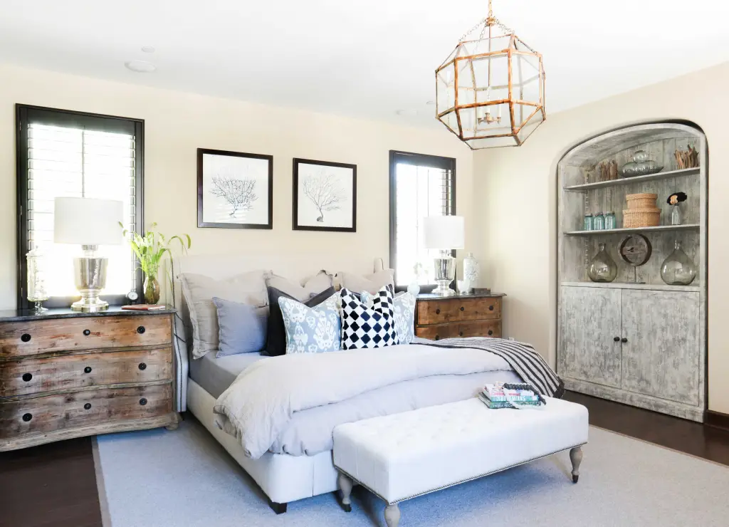 Bedroom with king size bed and metal chandelier