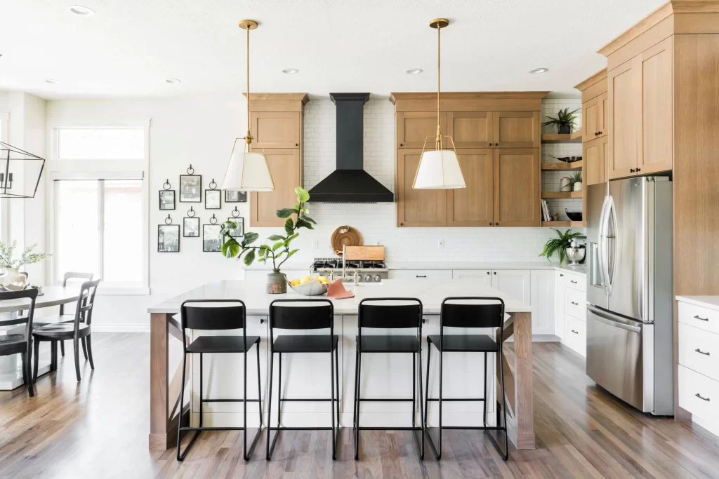 Dining space with kitchen island and a kitchen behind it