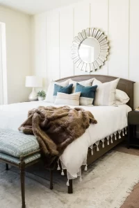 Bedroom with king size bed and mirror on the wall