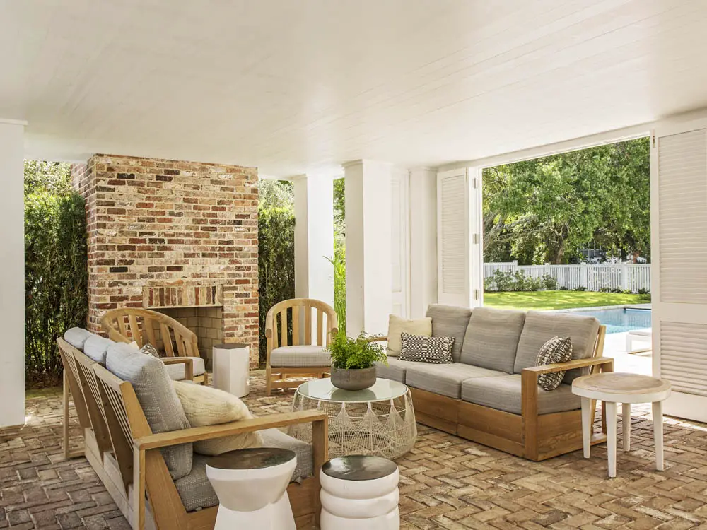 Outdoor garden with chairs, sofa and coffee table