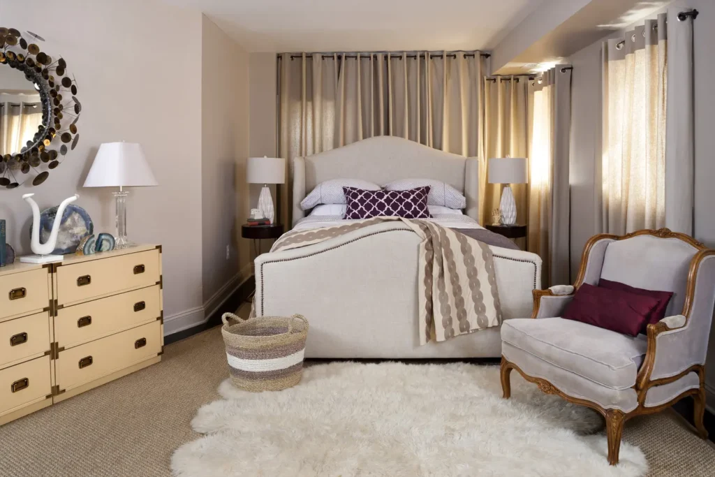 Stylish bedroom with antique armchair