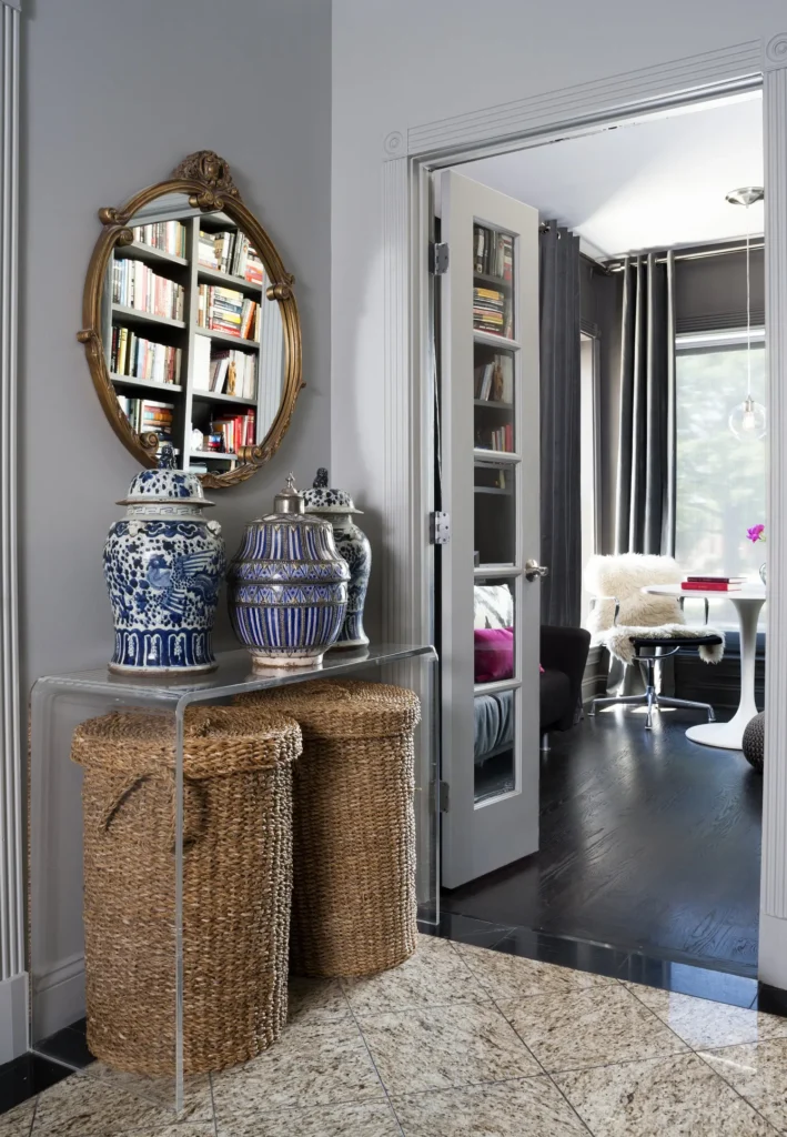 Part of the bedroom with mirror and vases